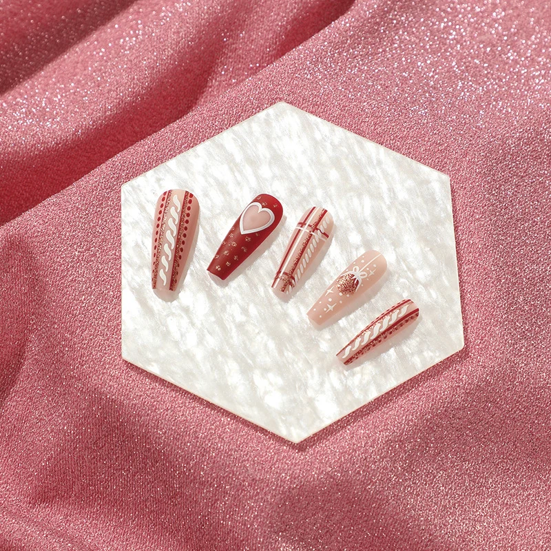 Artful nail art in festive design with heart and Christmas motifs Stornfield