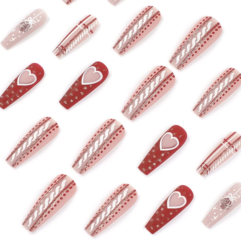 Artful nail art in festive design with heart and Christmas motifs Stornfield