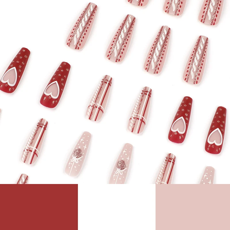 Artful nail art in festive design with heart and Christmas motifs Stornfield