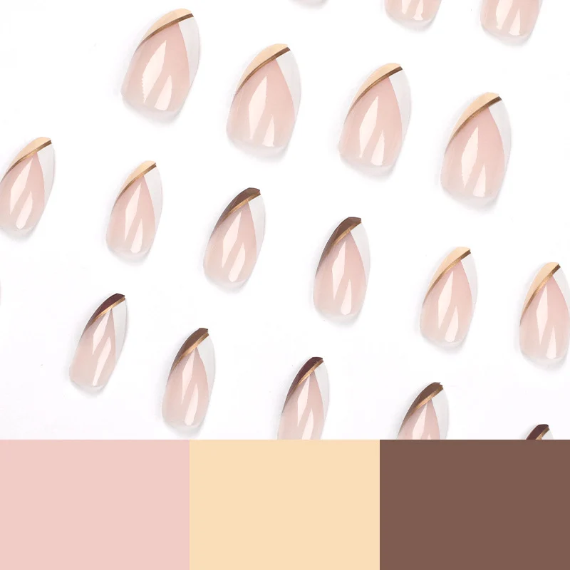 Artful nail art in elegant stiletto design with golden accents Stornfield