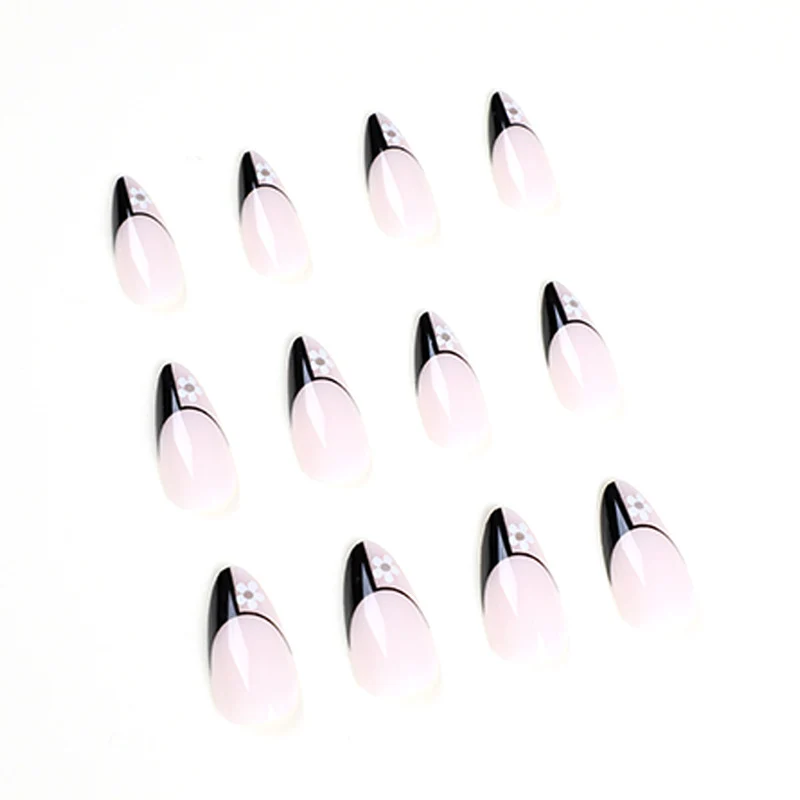 Artful nail art with elegant black-and-white design and floral accents Stornfield