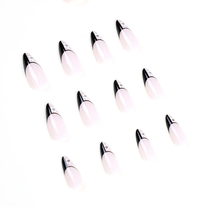 Artful nail art with elegant black-and-white design and floral accents Stornfield