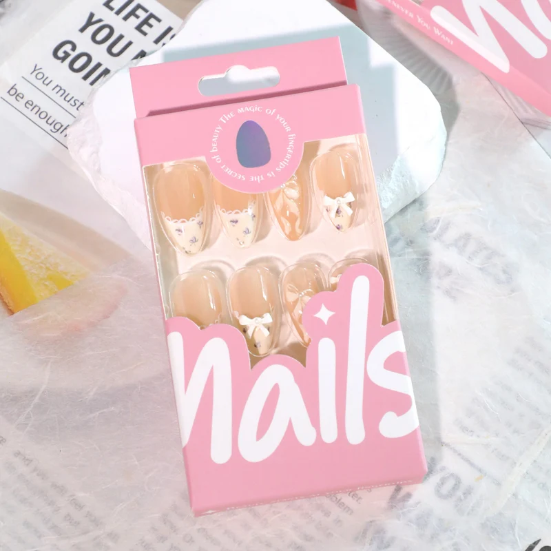 Artful nail art with elegant bows and rhinestone details Stornfield