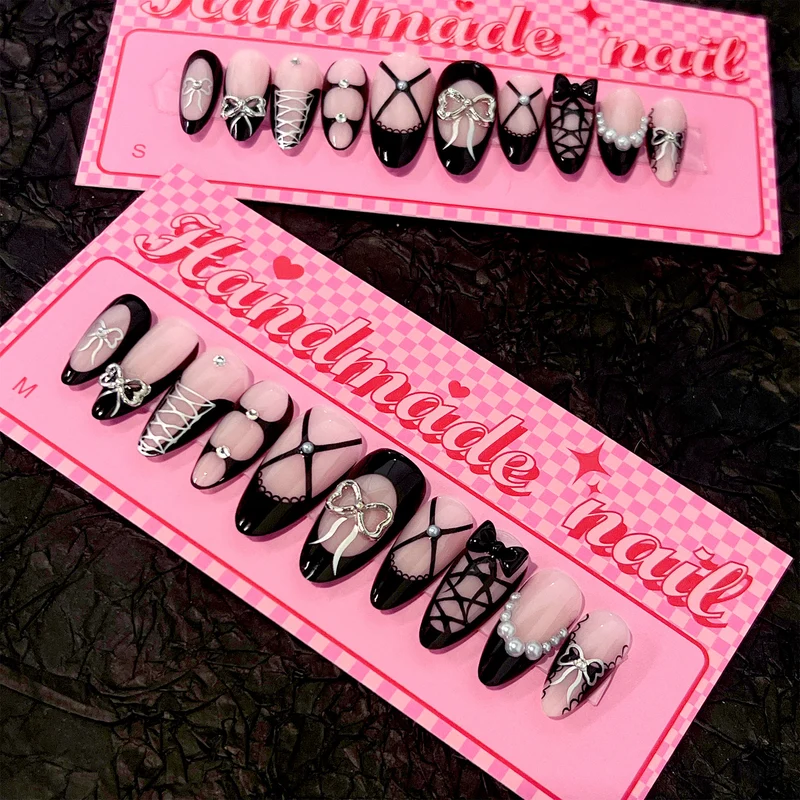 Artful nail art with elegant bows and glitter accents Stornfield