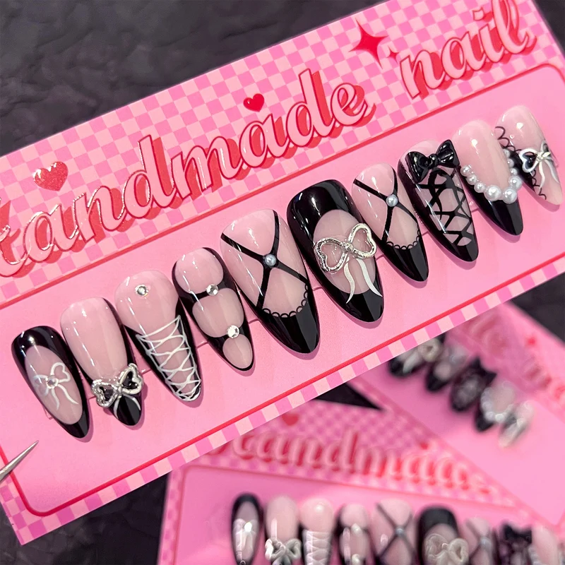 Artful nail art with elegant bows and glitter accents Stornfield
