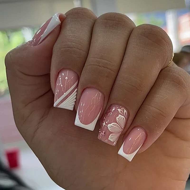 Artful Nail Art with Elegant French Tips and Floral Accents Stornfield