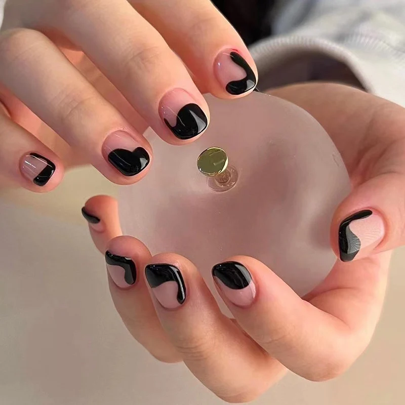 Artful nail art with elegant wave pattern and modern accents Stornfield
