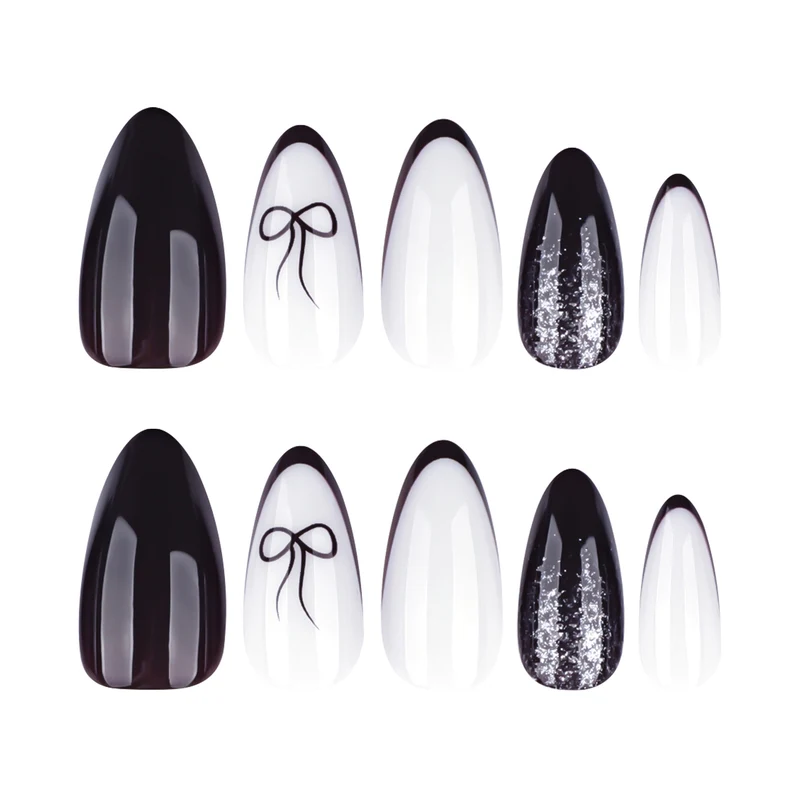 Artful nail art with elegant bow pattern and glitter accents Stornfield