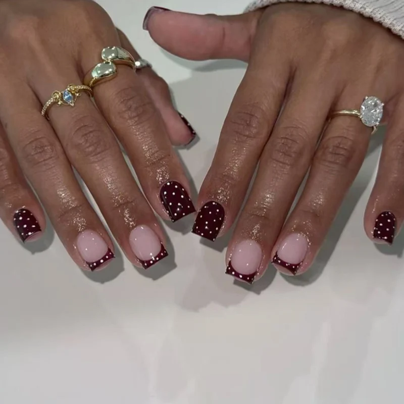 Artful nail art with elegant polka dot design Stornfield