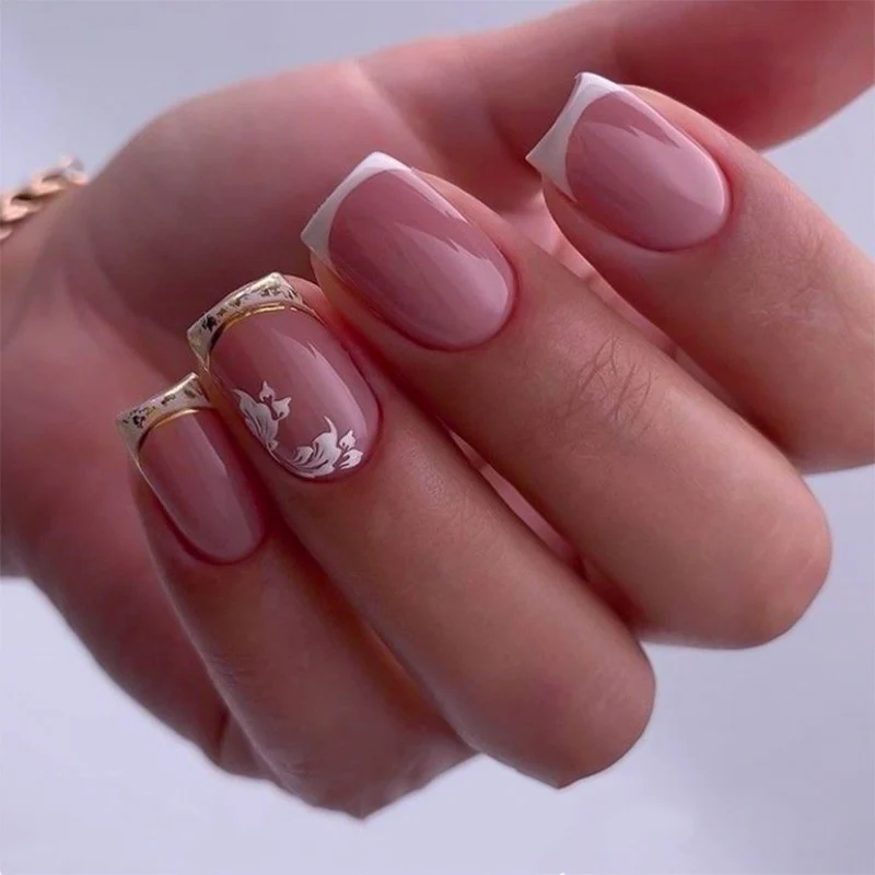 Artful nail art with elegant French tip and floral accents Stornfield
