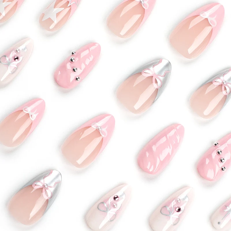 Artistic Nail Art with decorative bows and glitter accents Stornfield