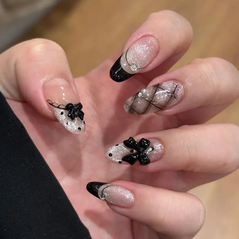 Artful Nail Art with Bow and Rhinestone Decorations Stornfield