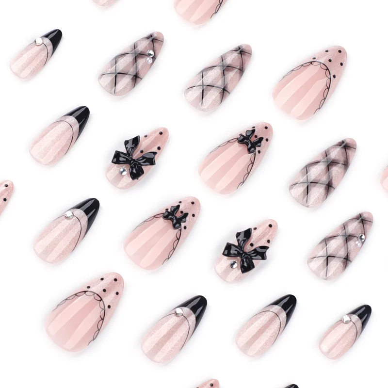 Artful Nail Art with Bow and Rhinestone Decorations Stornfield