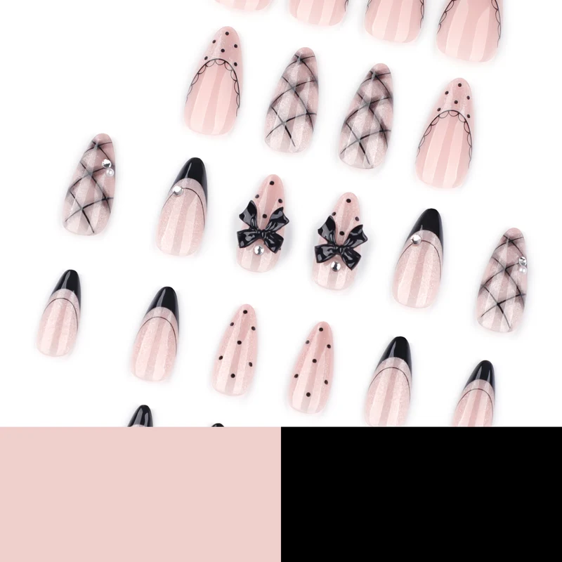 Artful Nail Art with Bow and Rhinestone Decorations Stornfield