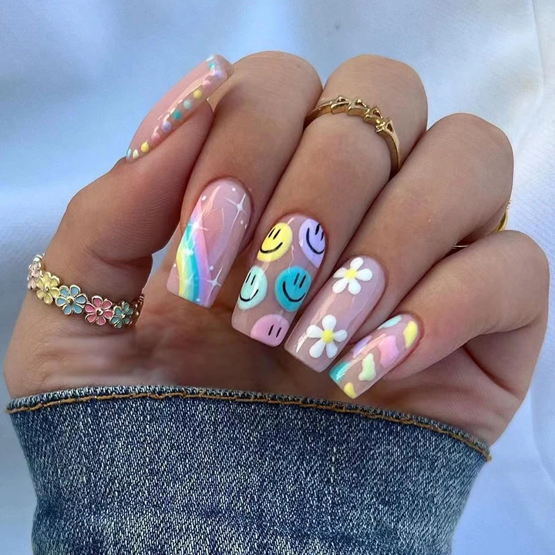 Artful Nail Art with Flower and Smiley Motifs Stornfield