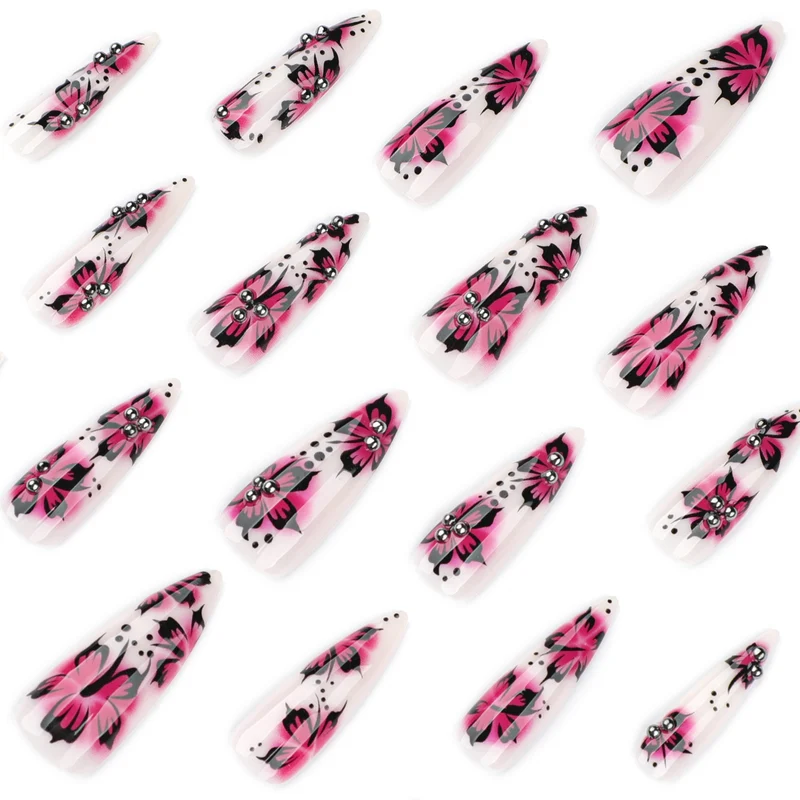 Artful nail art with floral design and rhinestone accents Stornfield