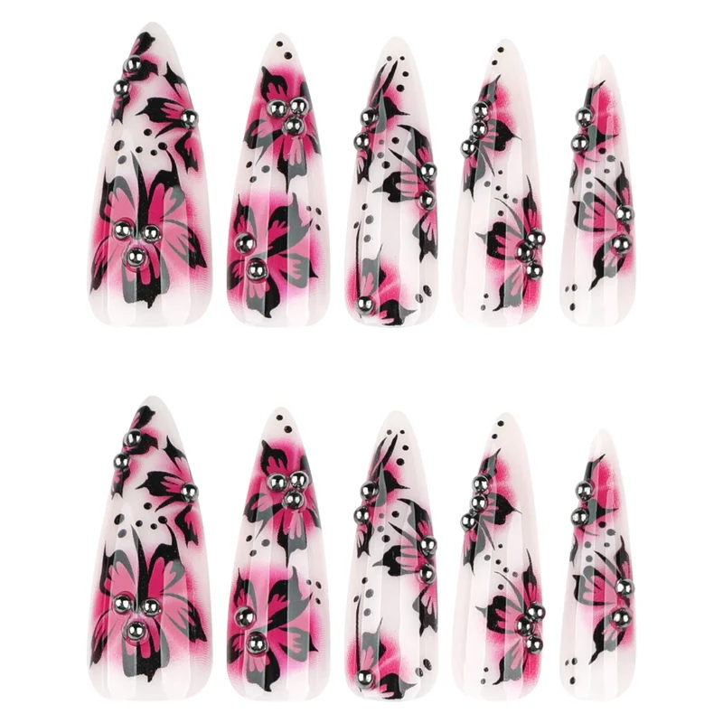 Artful nail art with floral design and rhinestone accents Stornfield
