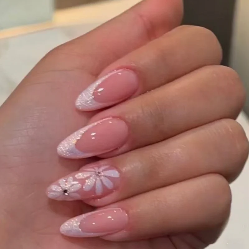 Artful Nail Art with Flower Design and Blue French Tip Stornfield