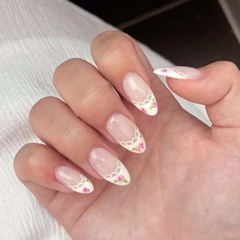 Artful Nail Art with Flower Design and Blue French Tip Stornfield