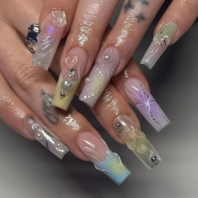 Artful nail art with 3D details and glitter accents Stornfield