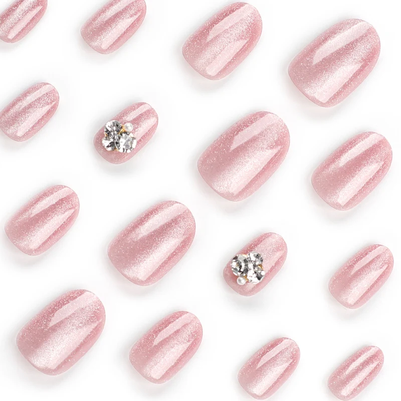Artful glitter nail extensions with elegant rhinestone accents Stornfield
