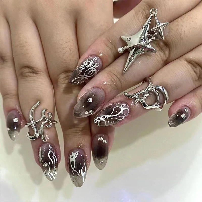 Artistic gel nails with delicate ornaments and glitter Stornfield