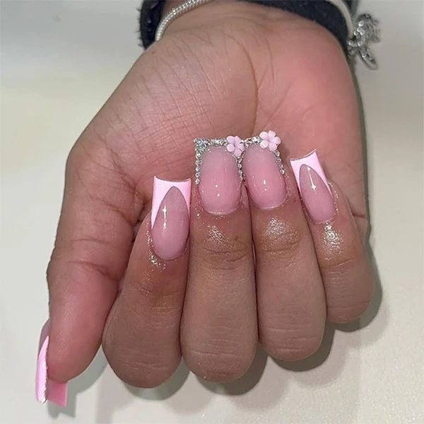 Artful gel nails with elegant floral design and glitter accents Stornfield