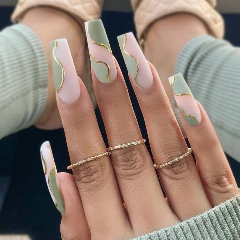 Artful Gel Nails with Elegant Wave Design and Gold Accents Stornfield