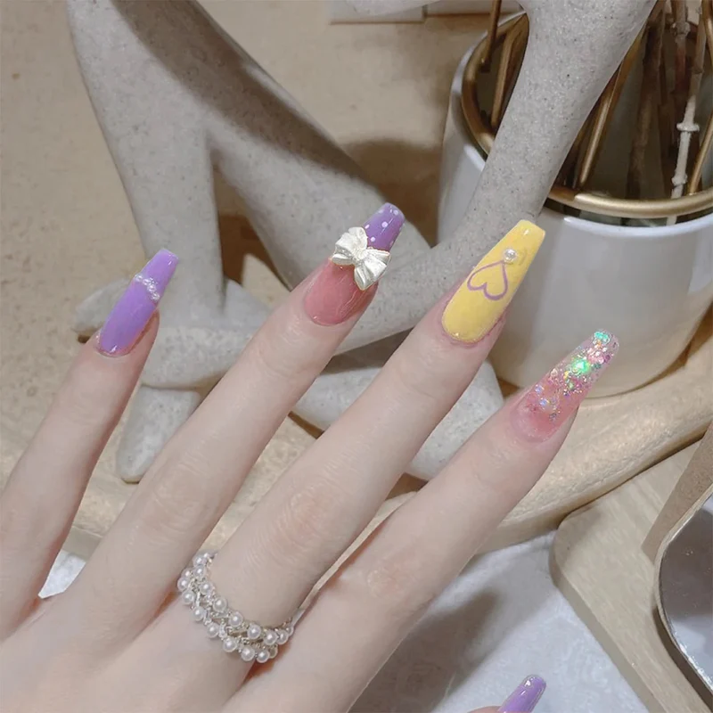 Artful Gel Nails with Elegant Floral Design and Glitter Accents Stornfield