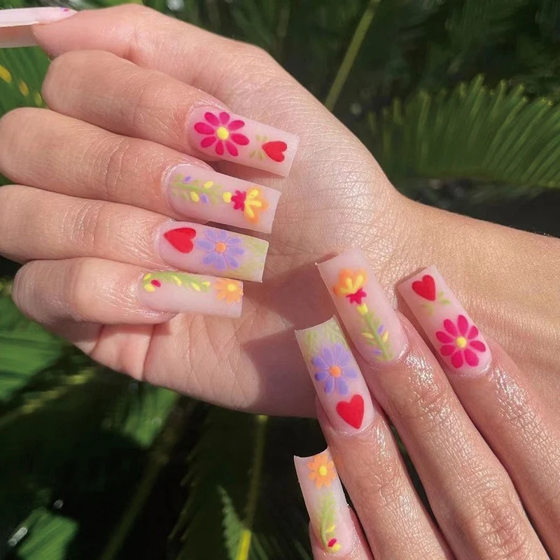 Artful Gel Nails with Elegant Floral Design and Glitter Accents Stornfield