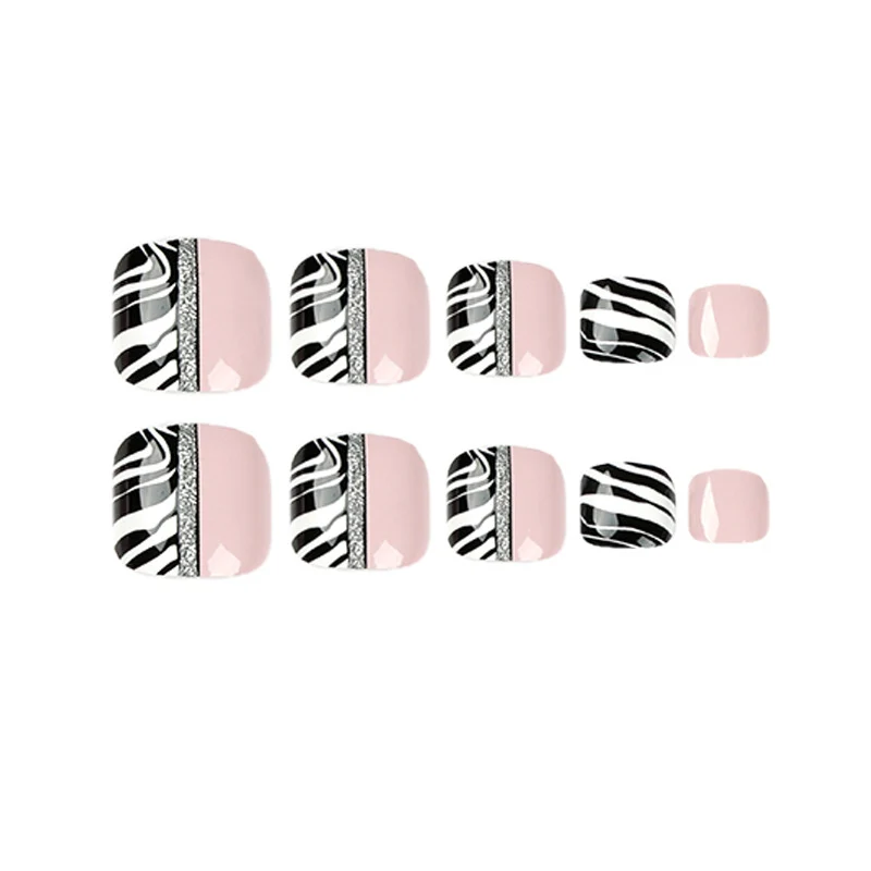 Artistic toenail art with zebra pattern and glitter accents Stornfield