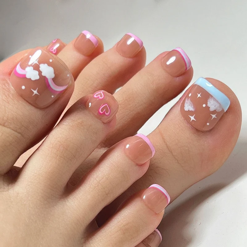 Artful toenail art with heart and cloud motifs Stornfield