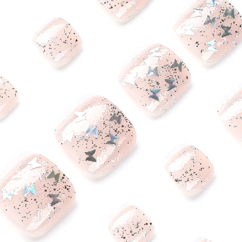 Artful toenail art with glitter and butterfly designs Stornfield