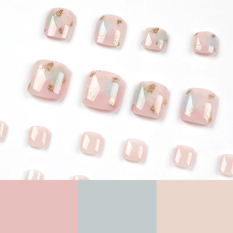 Artful toenail art with elegant marble and gold accents Stornfield