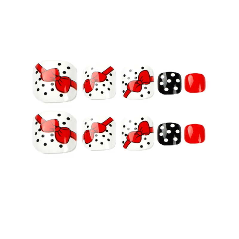 Artful toenail design with elegant bow motifs Stornfield