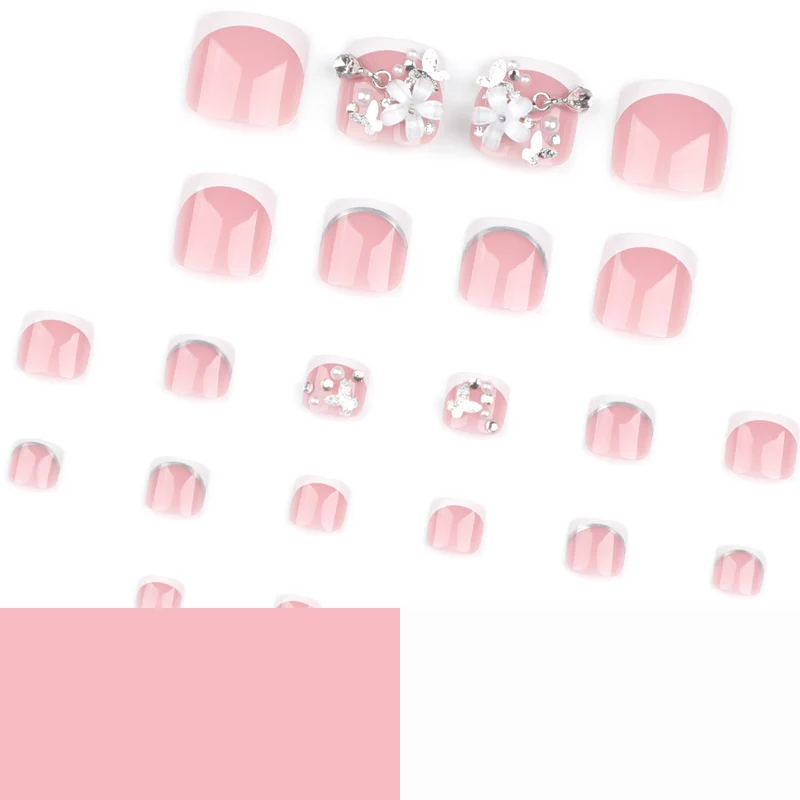 Artful toenail design with elegant flower and glitter accents Stornfield