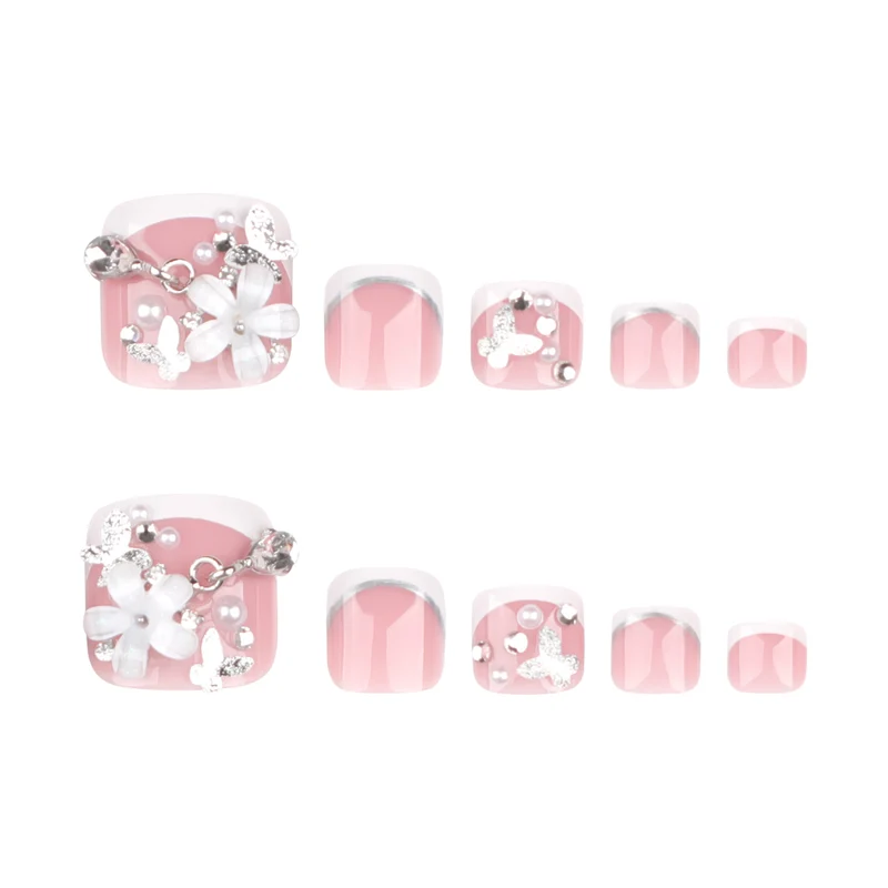 Artful toenail design with elegant flower and glitter accents Stornfield