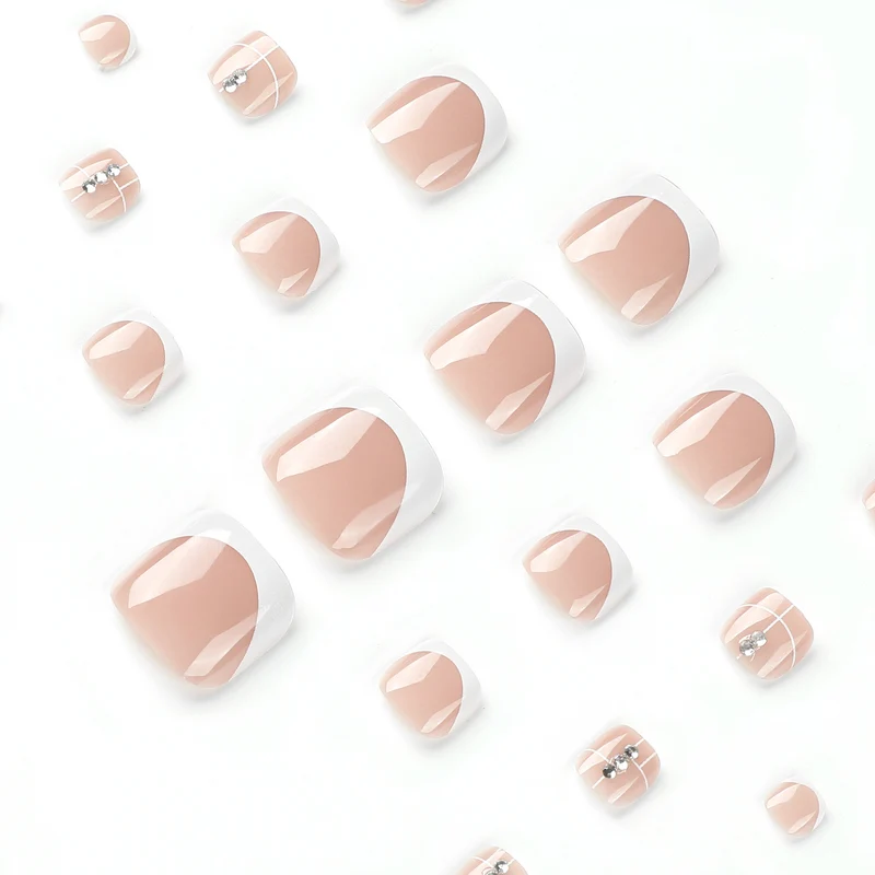 Artful toenail design with elegant style and rhinestone embellishments Stornfield