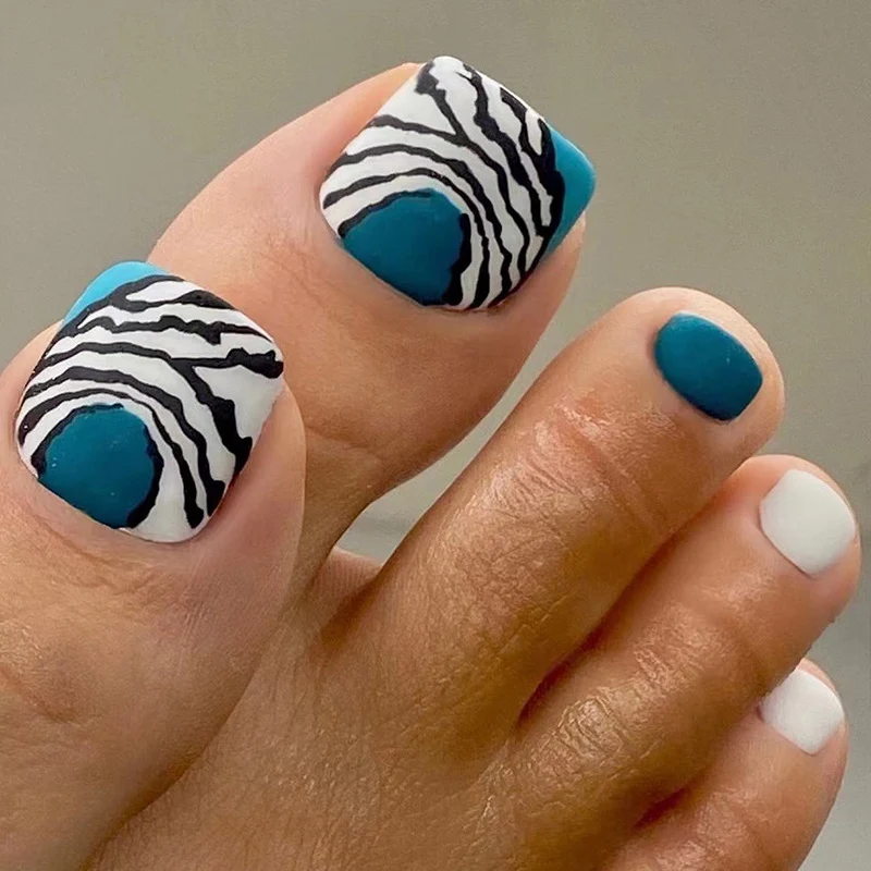 Artful toenail design in modern zebra pattern Stornfield