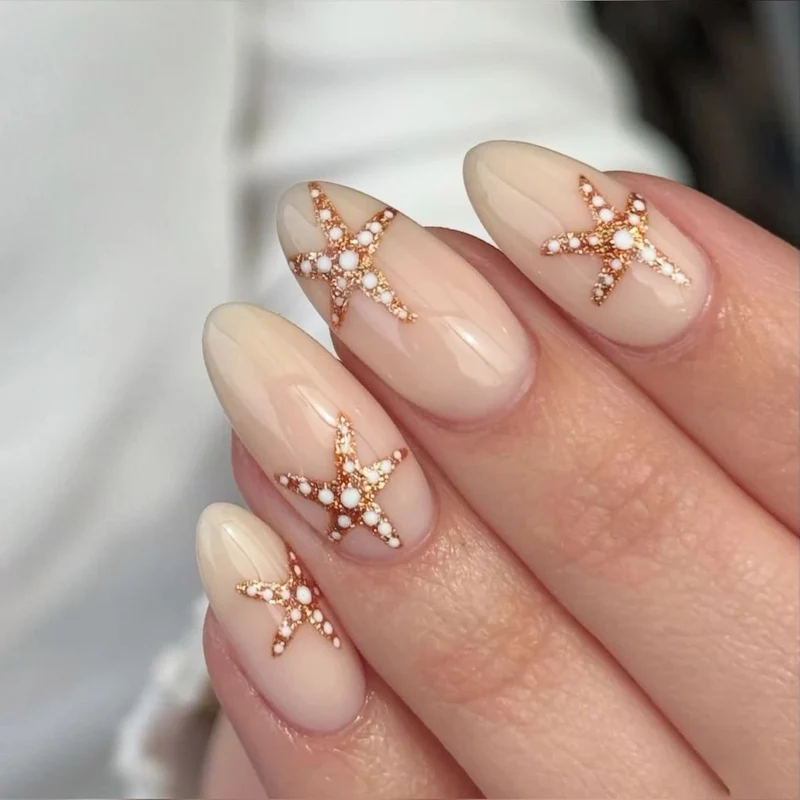 Artistic acrylic nails with maritime star designs Stornfield