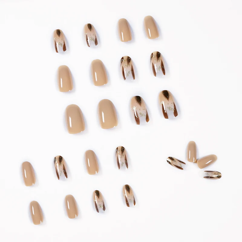 Artificial nail extensions with modern design and glitter accents Stornfield