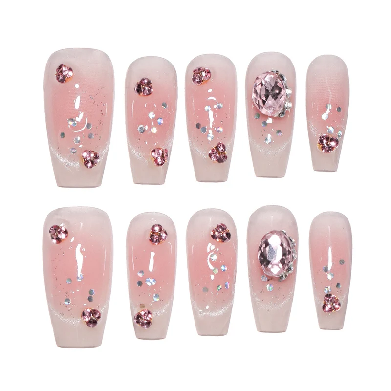 Artificial nail extensions with artistic glitter accents Stornfield