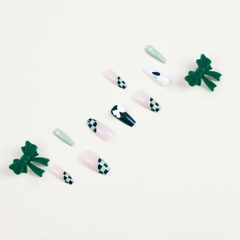 Artificial nail extensions with creative design and glitter accents Stornfield