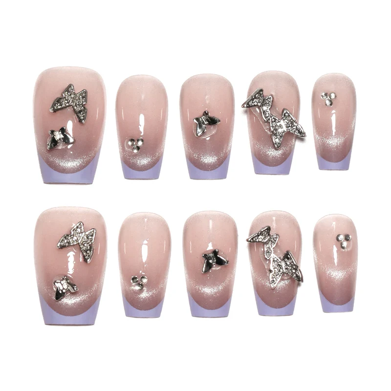 Artificial nail extensions with glitter design and elegant accents Stornfield