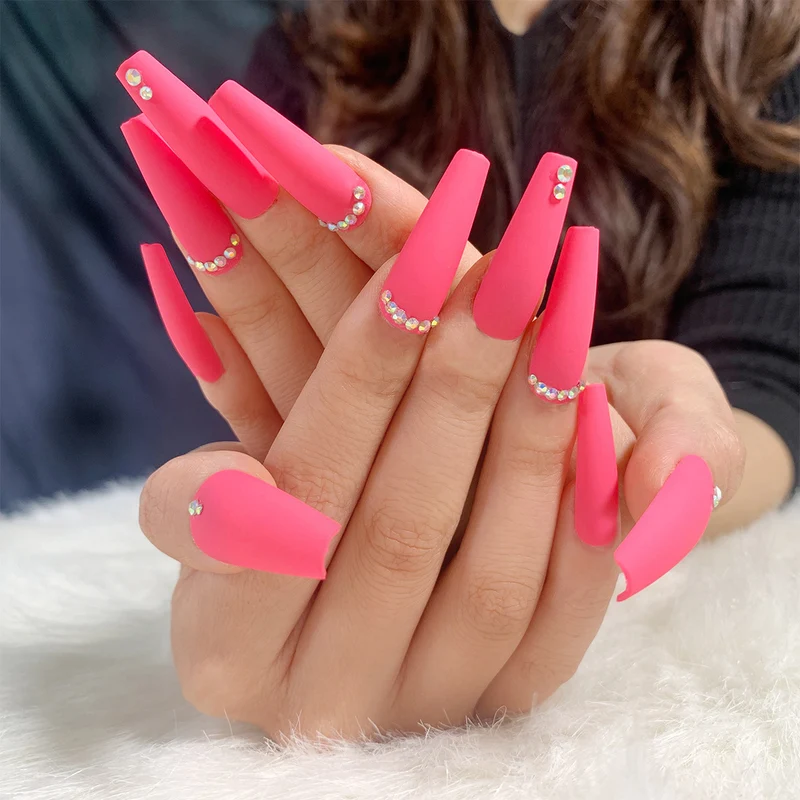 Artificial nail extensions with glitter accents Stornfield