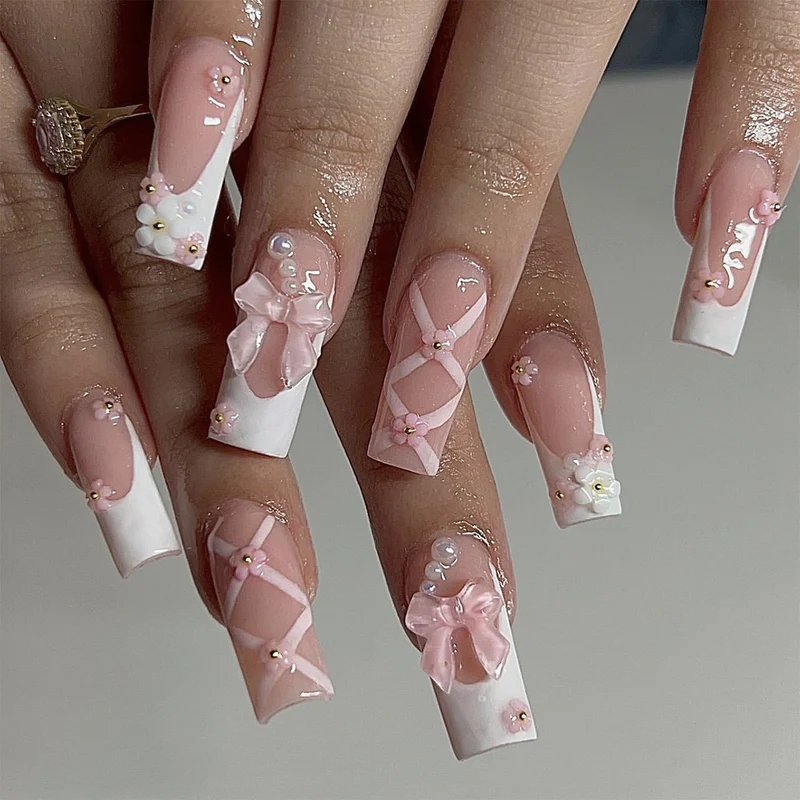 Artificial nail extensions with floral accents Stornfield