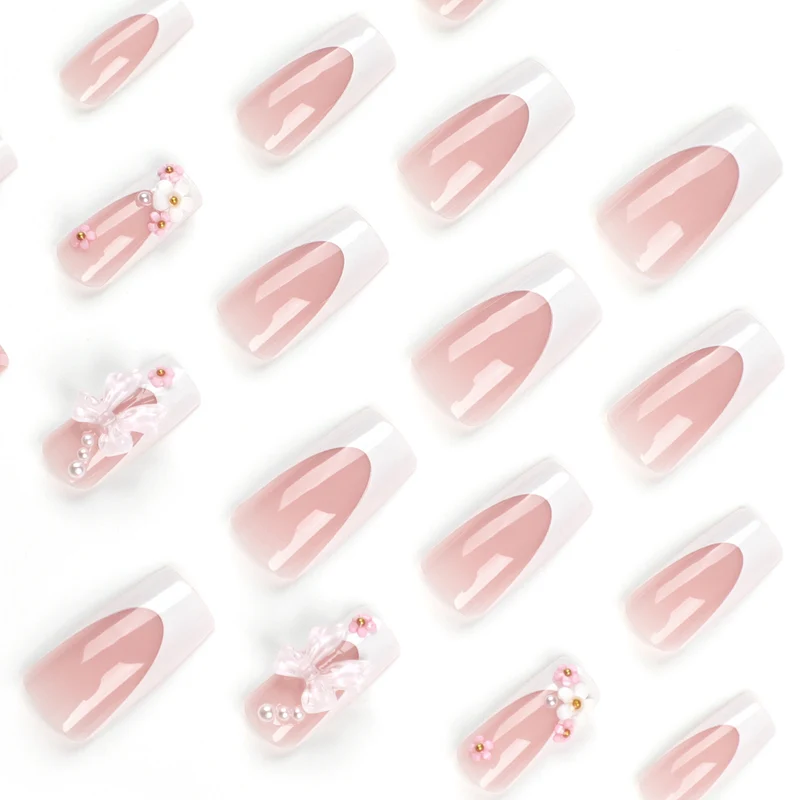 Artificial nail extensions with floral accents Stornfield