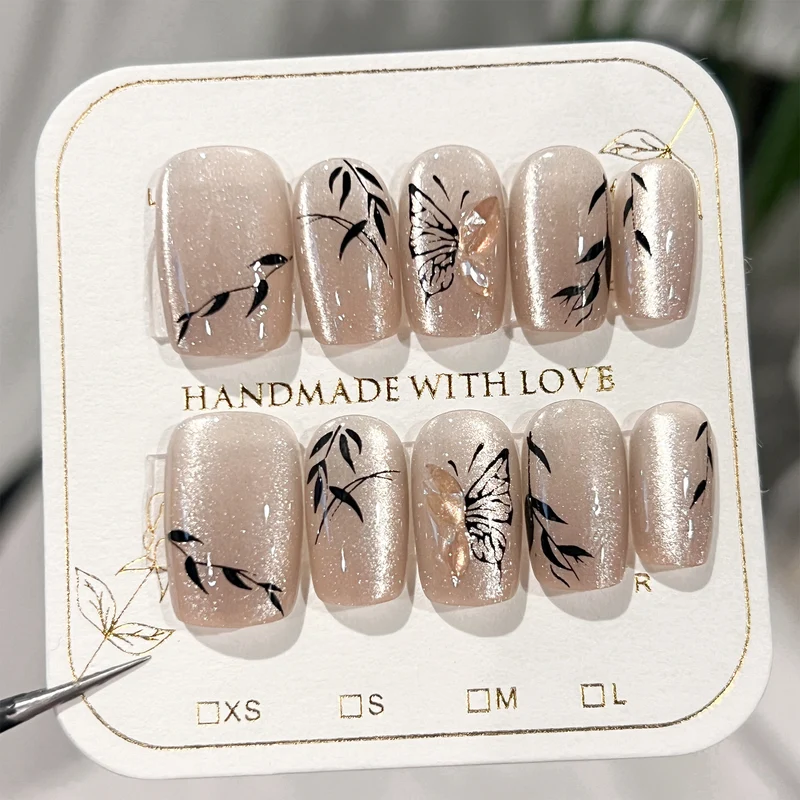 Artificial nail extensions with floral butterfly design Stornfield