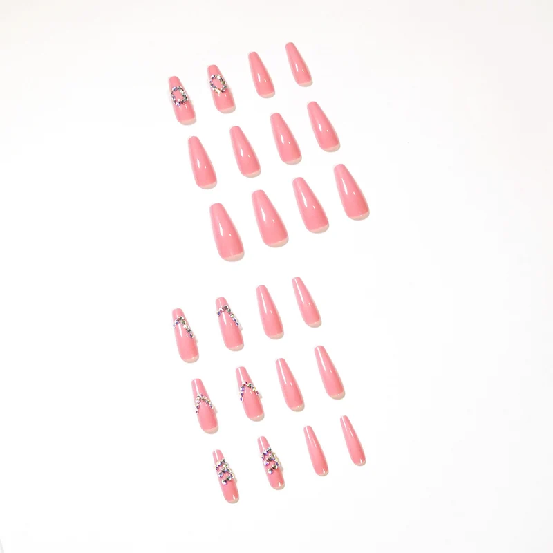 Artificial nail extensions with elegant rhinestone embellishments Stornfield