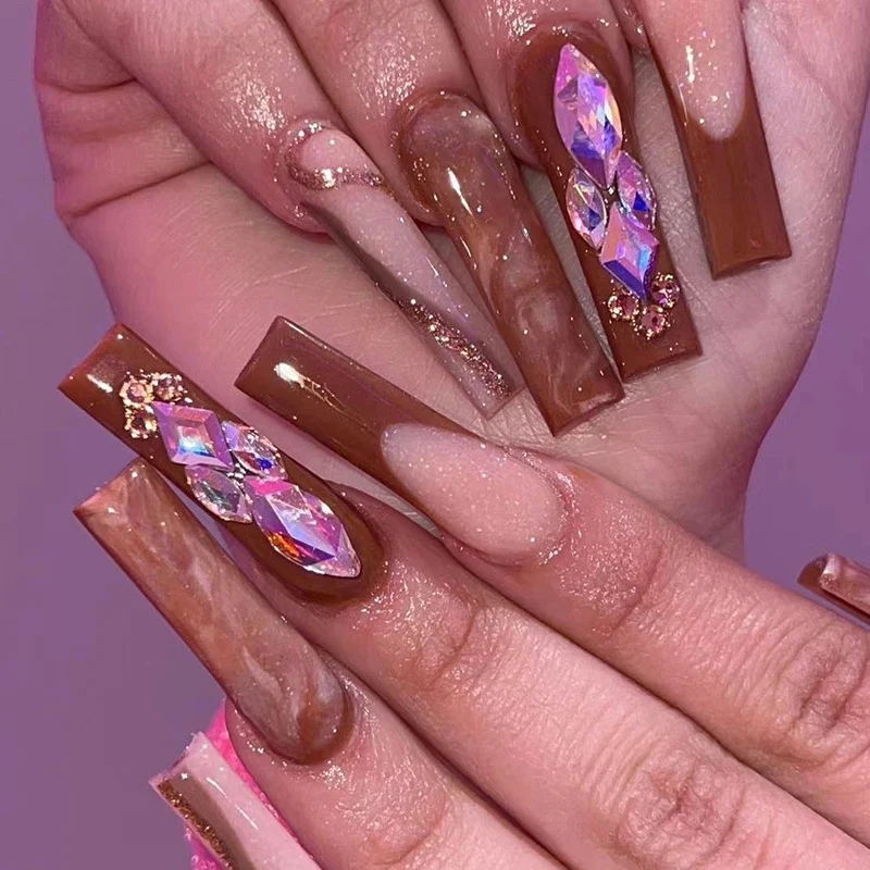 Artificial nail extensions with elegant gemstone embellishments Stornfield